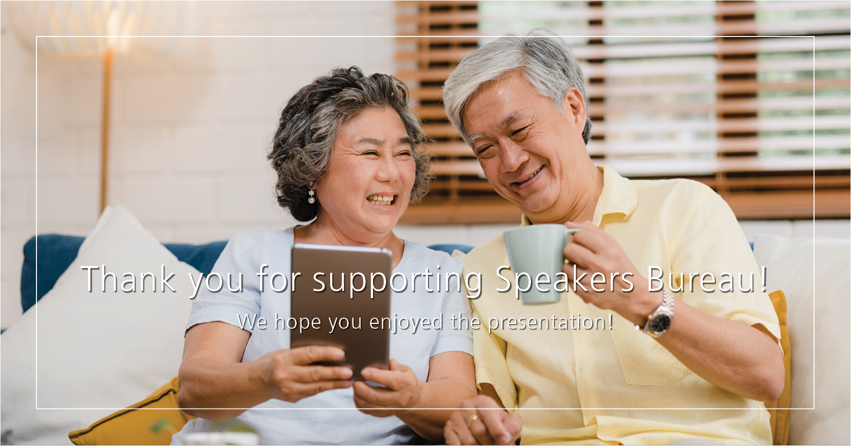 An older asian couple smiling together with a tablet and the words "Thank you for supporting Speakers Bureau! We hope you enjoyed the presentation.